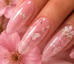 Illustrative study of pink nails with white butterfly and floral line art. Not work from this parlor.