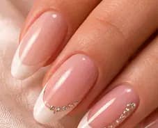 Illustrative study of a French manicure with a curved line of clear stones. Not work from this parlor.