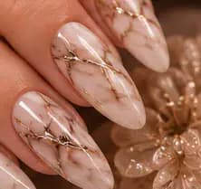 Illustrative study of white nails with gold marble veining. Not work from this parlor.